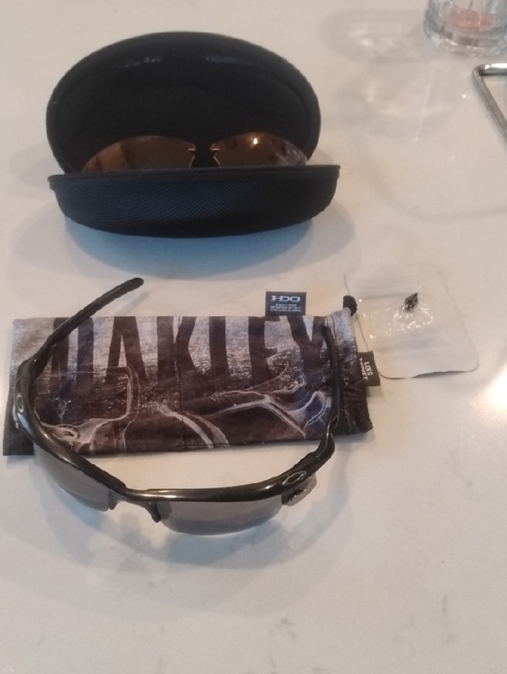 Oakley Black Frame Sunglasses with Gray And Orange Lenses